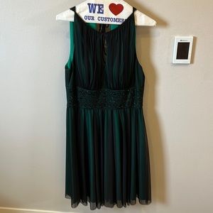 Beautiful retro style cocktail dress. Green w/black overlay and black beading